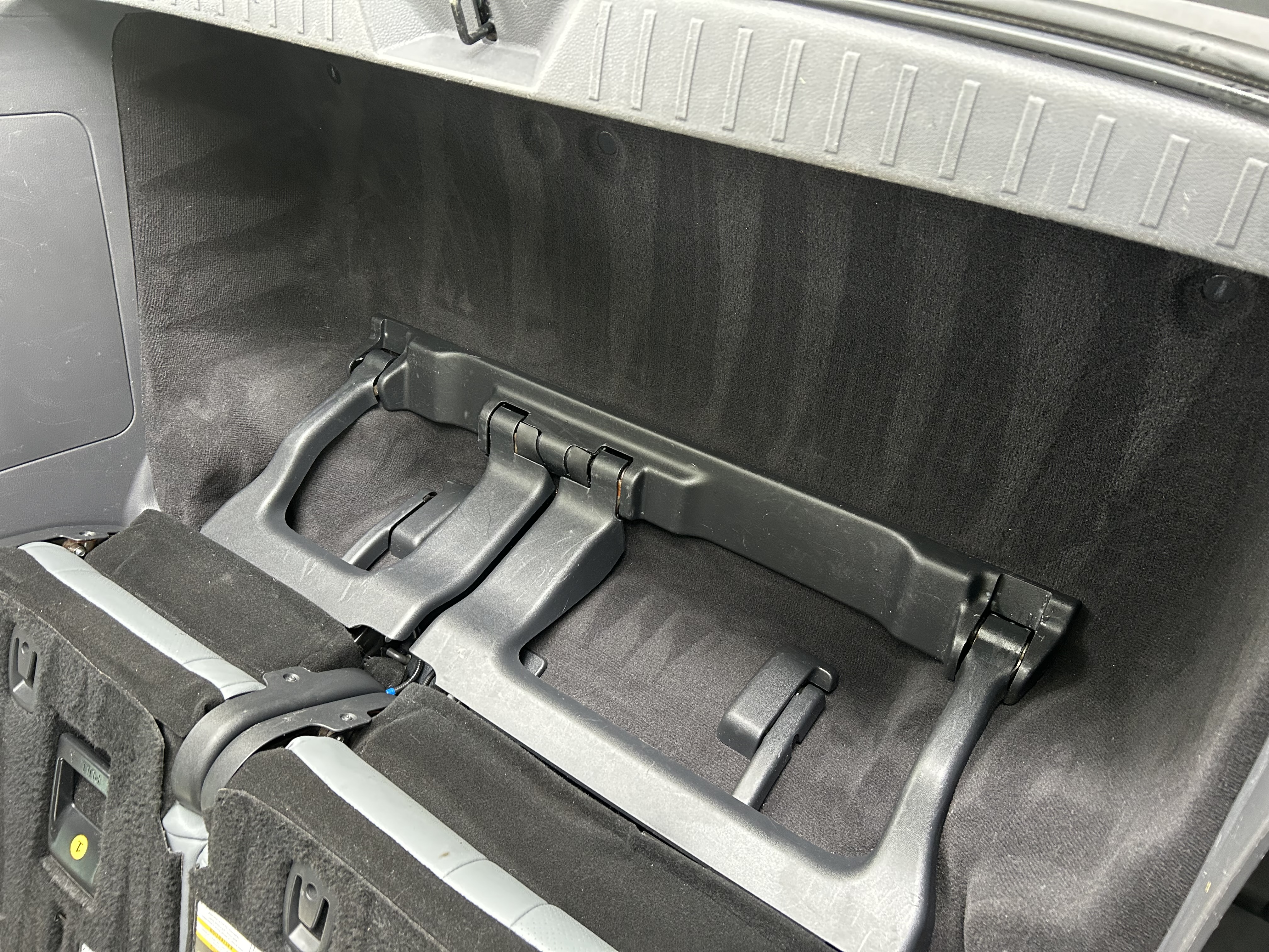 Minivan cargo floor — heavily soiled before detail