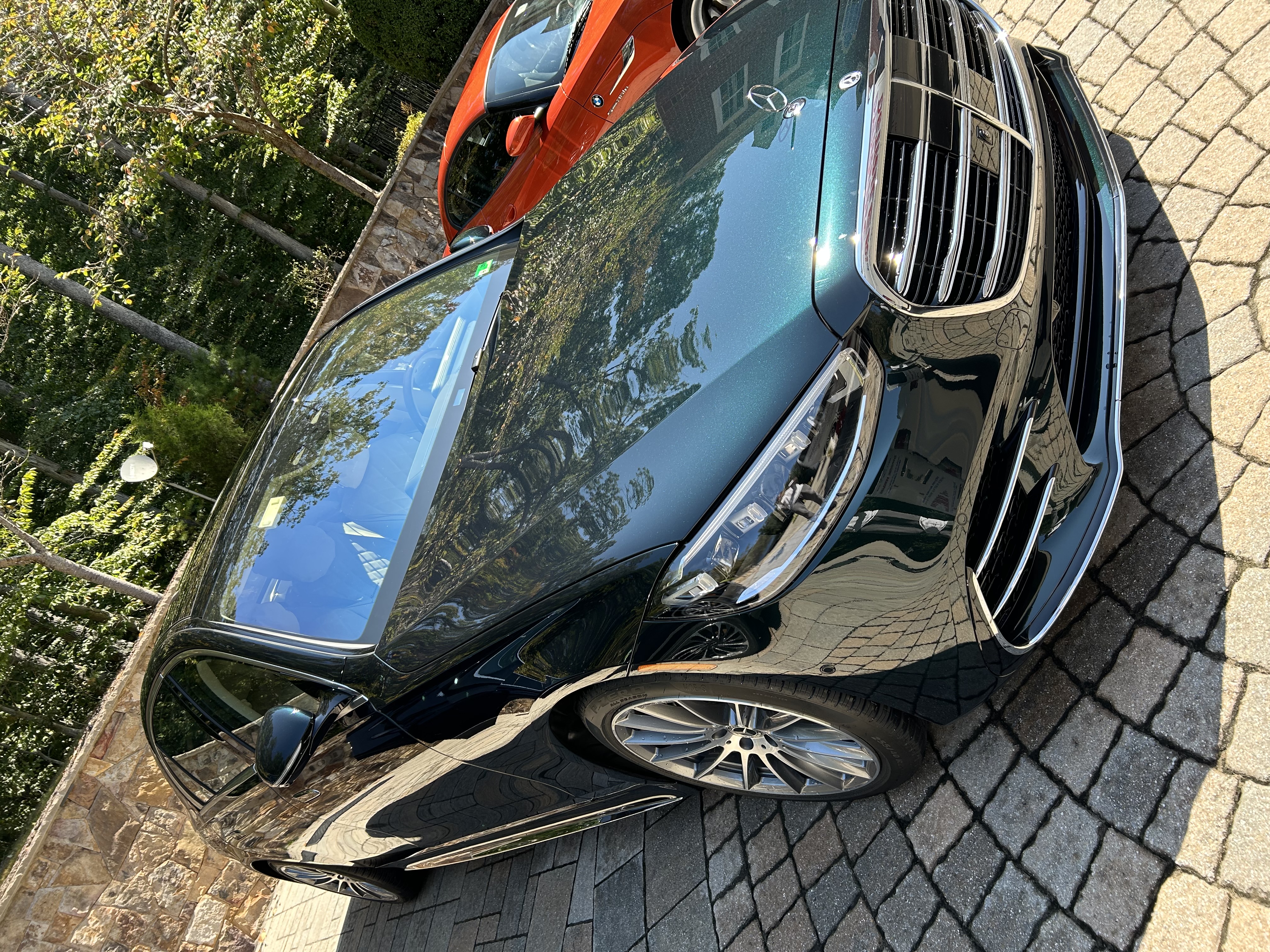 Mercedes — deep teal mirror paint after full detail