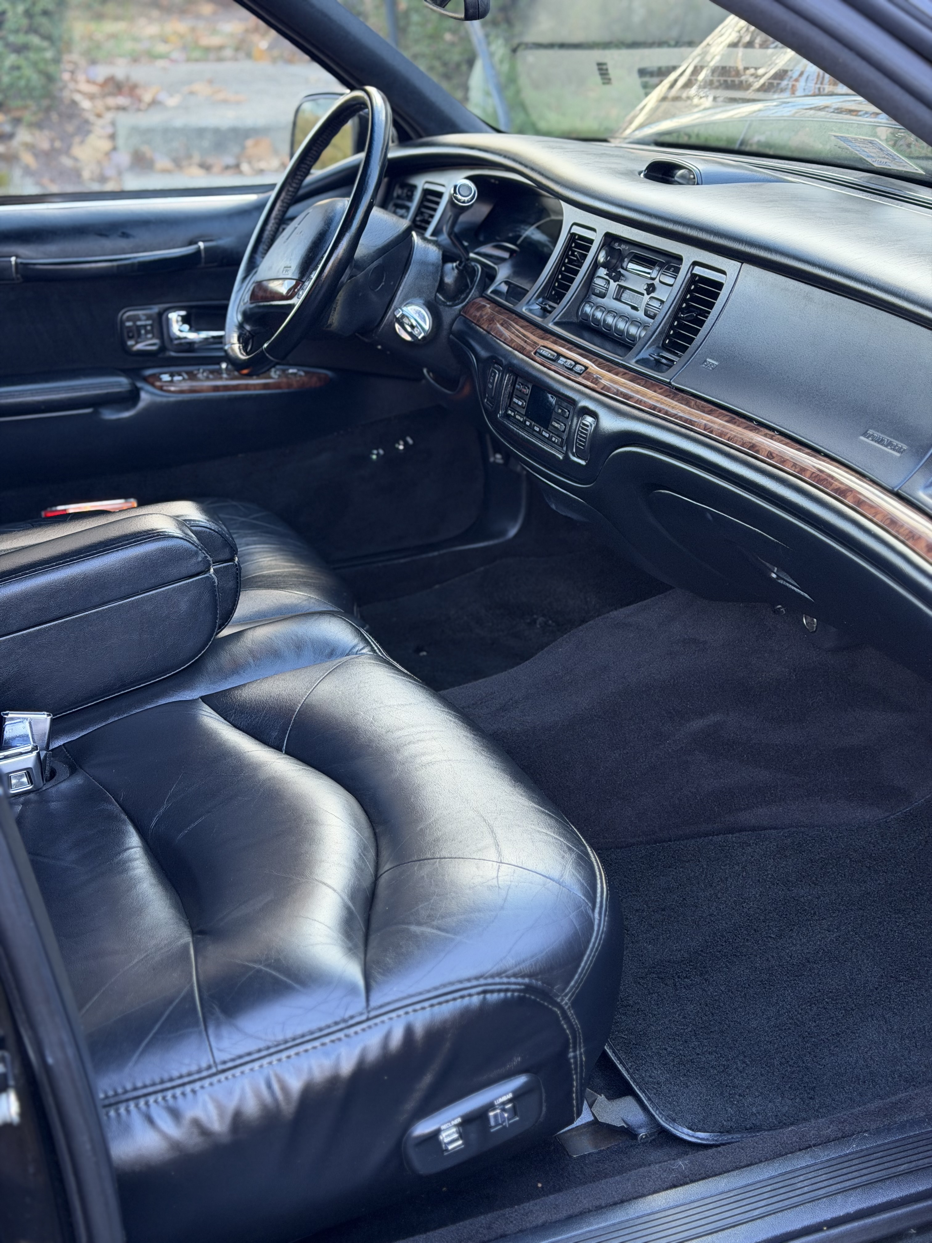 Lincoln Town Car — clean black leather front interior