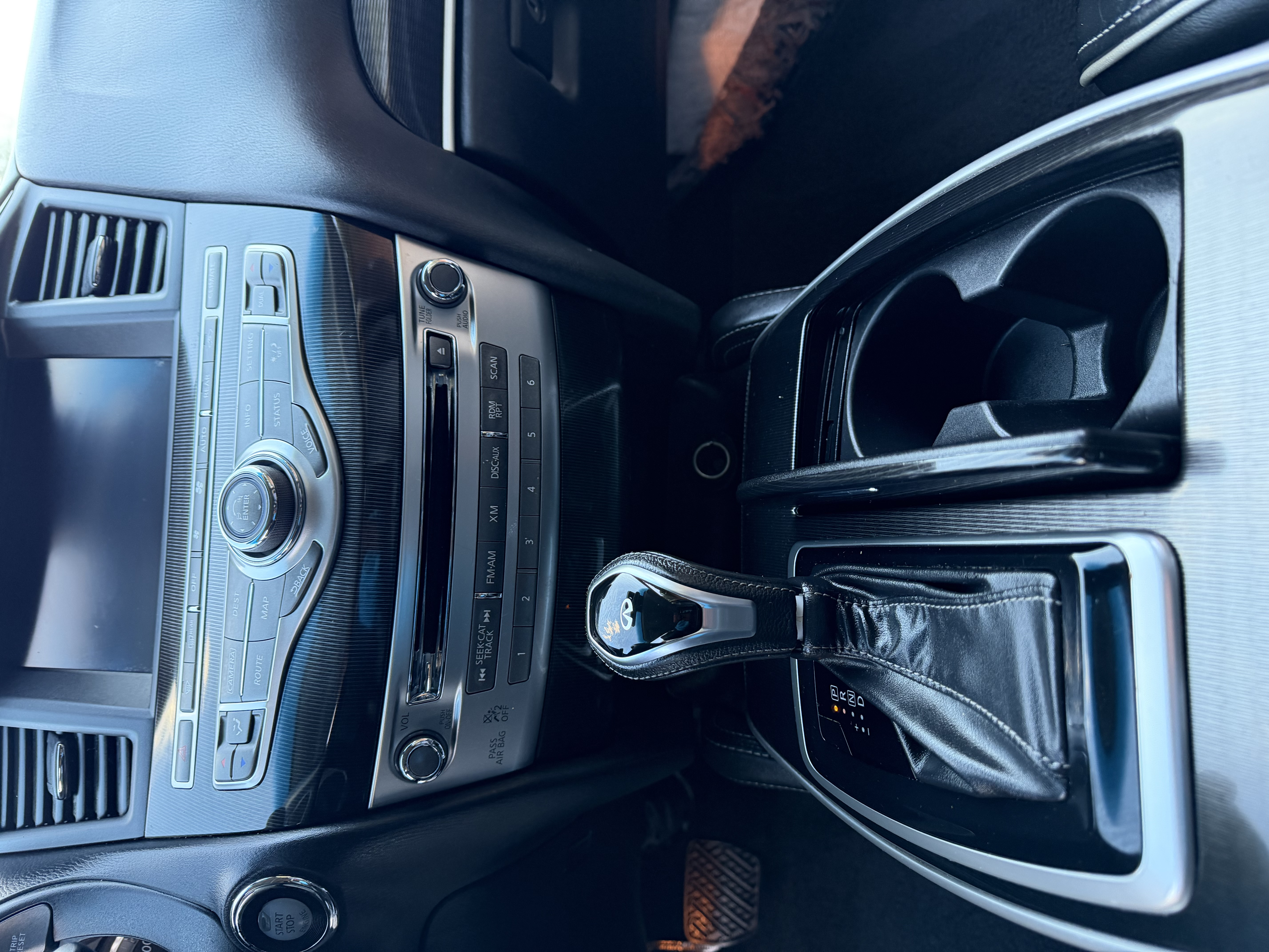 Infiniti center console — polished and clean after detail