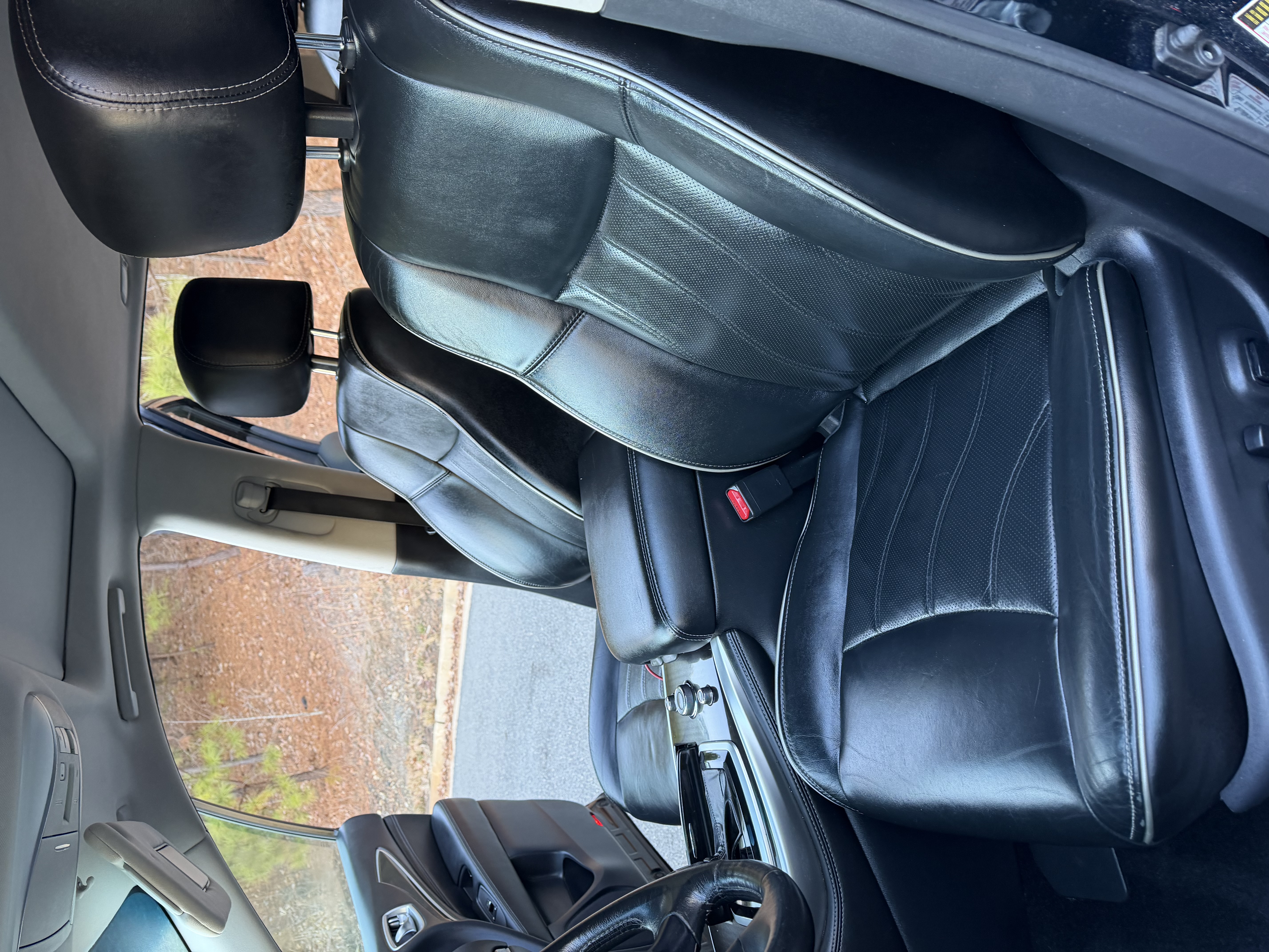 Infiniti seats — clean conditioned leather after detail