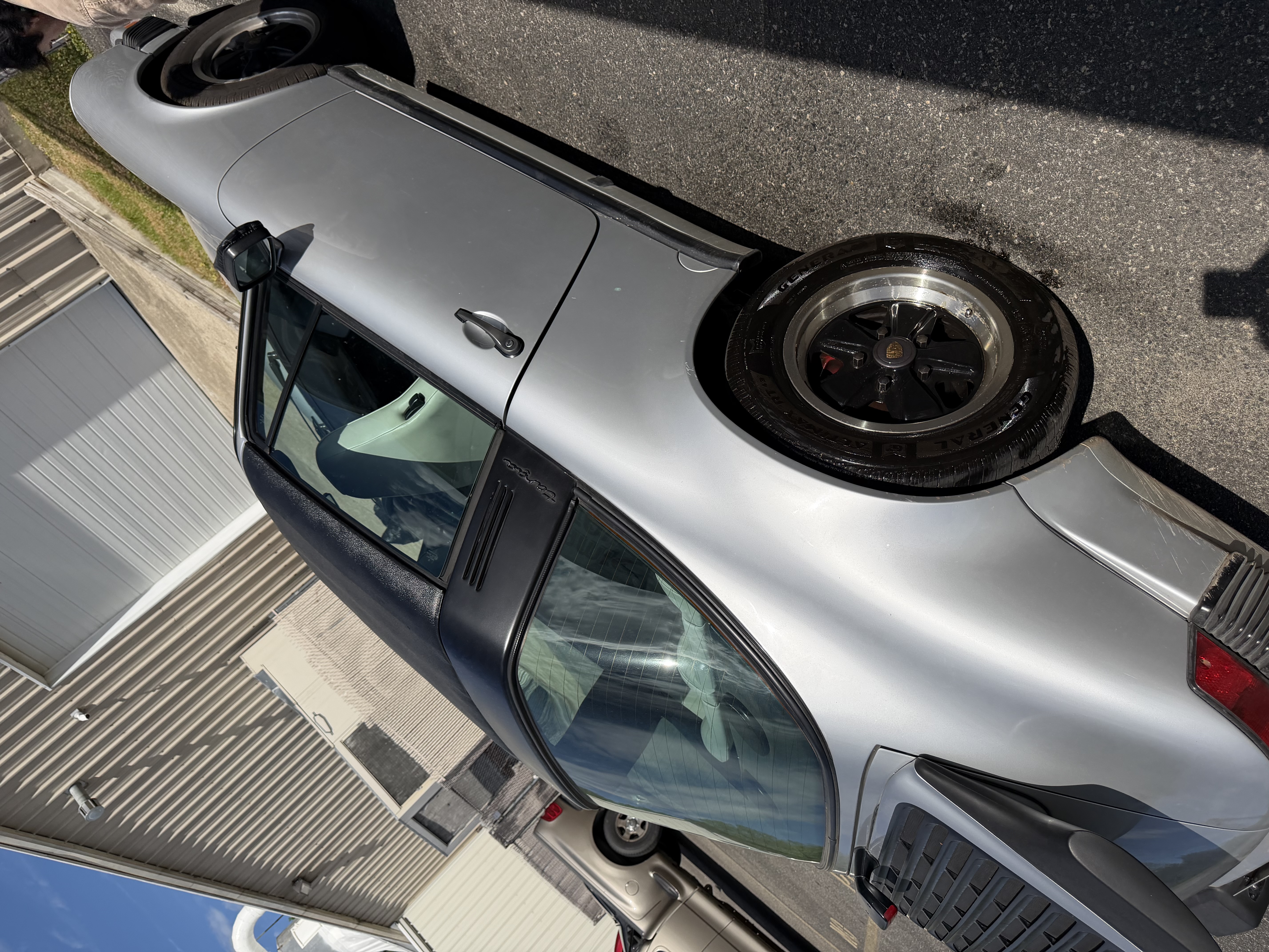 Porsche 911 — gleaming side profile after detail