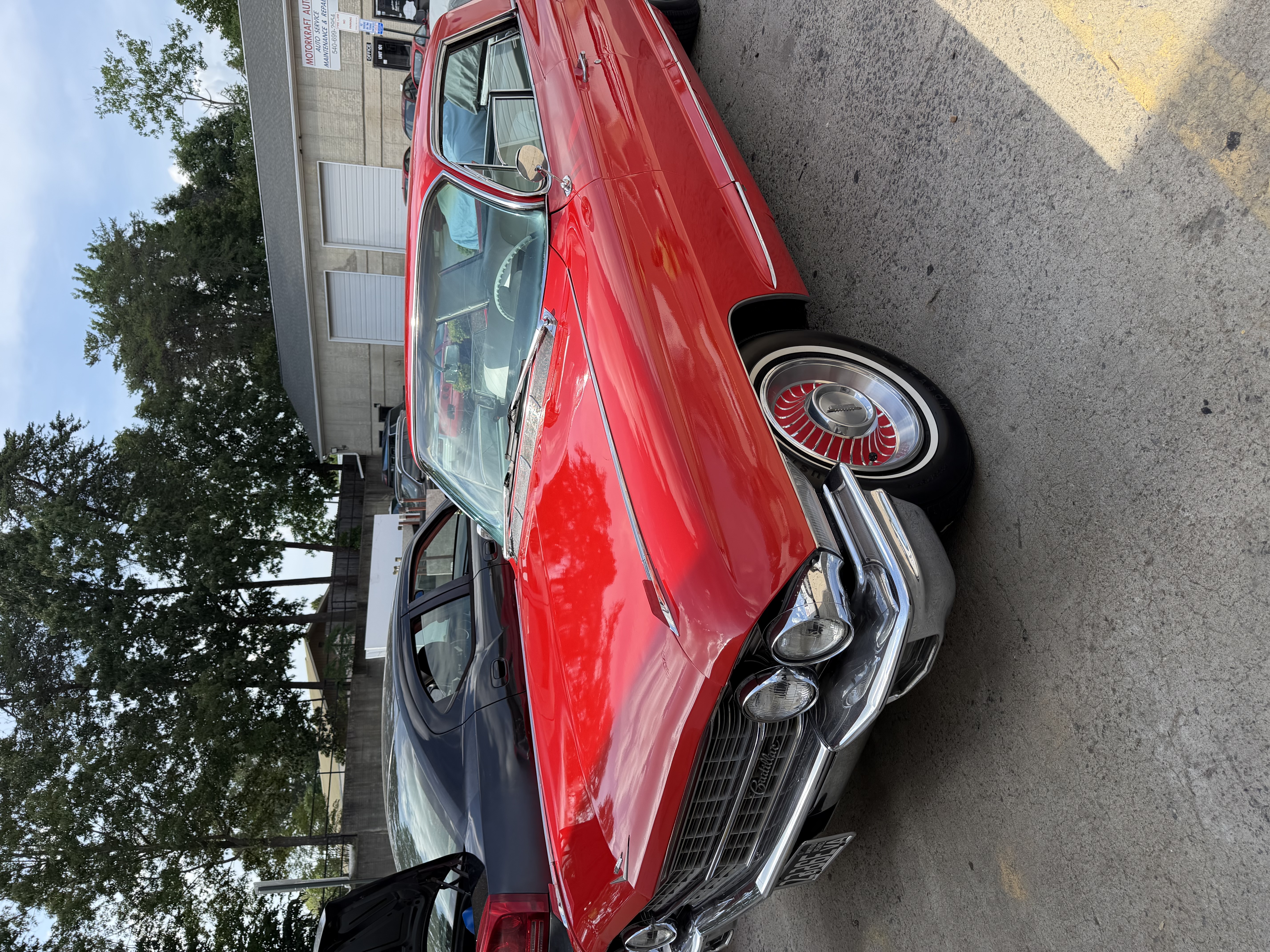 Classic Cadillac — gleaming red paint after detail